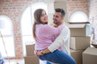 © Krakenimages.com - Young beautiful couple hugging in love celebrating very happy moving to new apartment