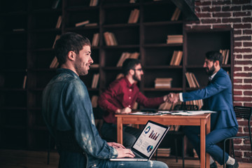 Wall Mural - sales Manager working on laptop with a marketing report