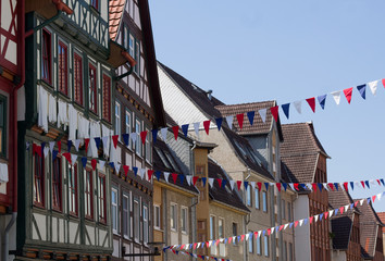 old historic half timbered houses with festival decoration in schmalkalden, thuringia, germany