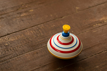 Spinning whirligig on old floor