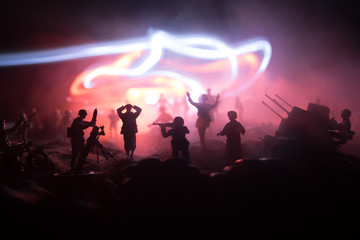 War Concept. Military silhouettes fighting scene on war fog sky background,