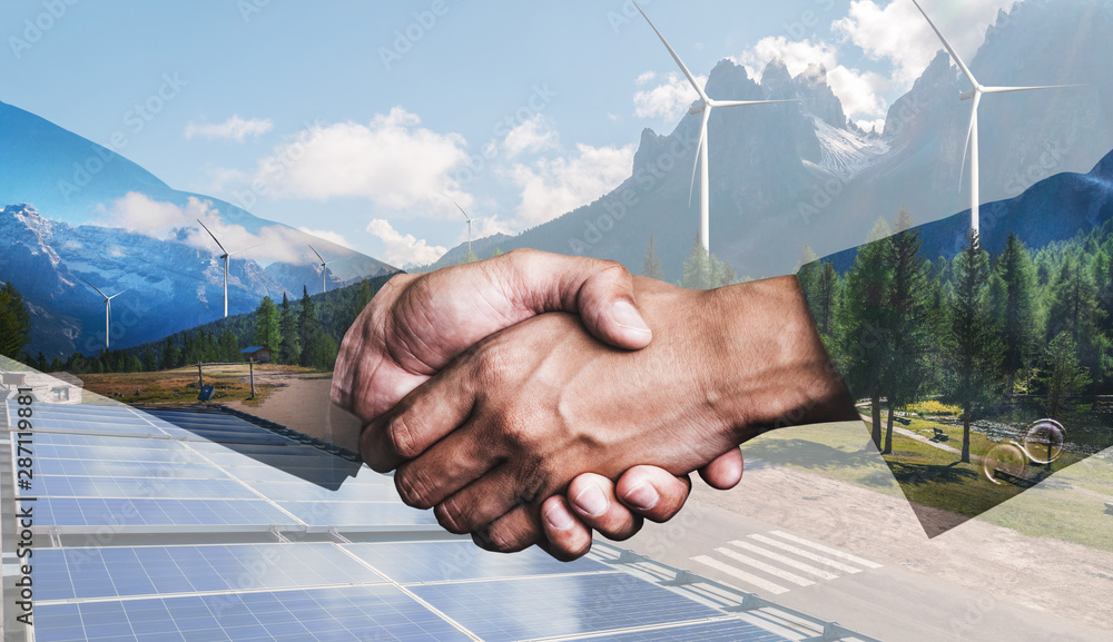 Double exposure graphic of business people handshake over wind turbine farm and green renewable energy worker interface. Concept of sustainability development by alternative energy. - obrazy, fototapety, plakaty 