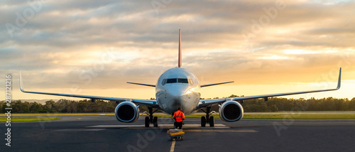 Sunset view of airplane on airport runway under dramatic sky in Hobart,Tasmania, Australia Fototapete