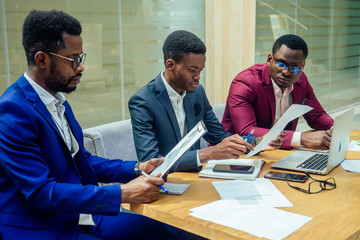 Wall Mural - mixed race business people sitting in modern office copy space