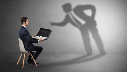 Canvas Print - Businessman staying and offering stuffs to a shadow businessman