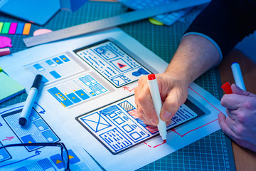 Wall Mural - ux ui designer. graphic designer draws apps. design a personal account in the application. design pr