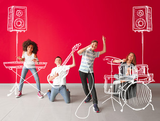 Wall Mural - Teenage musicians with drawing instruments playing against color wall