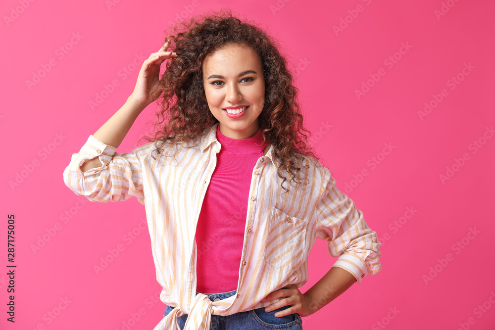 Stylish African-American woman on color background