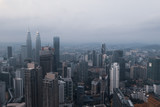 Fototapeta  - Aerial drone view of Kuala Lumpur city skyline during cloudy day
