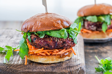 Canvas Print - Vegetarian beetroot burger with avocado and carrot slaw in brioche bun