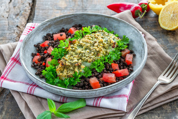 Canvas Print - Pesto-crusted cod with Puy lentils and tomatoes in a bowl