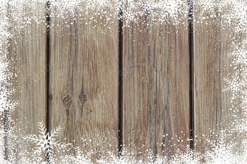 Fotomural Christmas winter background with snowflakes on wood