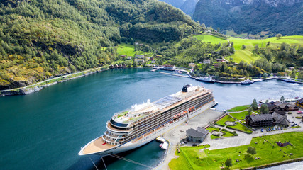 Big passenger ship in a bay. Picturesque, beautiful bay with a cruise ship.