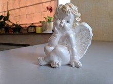 Statuette Of An Angel. White Porcelain Angel