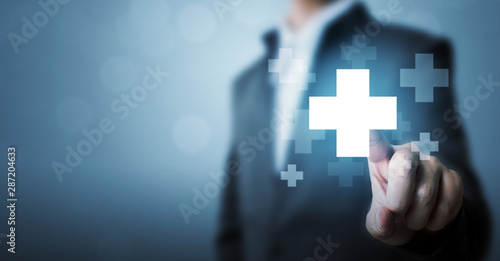 Fotomural Businessman hand touching plus sign icon means to offer positive thing (like ben