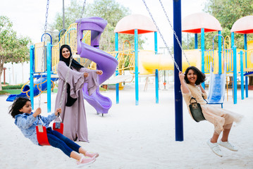 Wall Mural - Arabian family spending time in a park