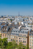 Fototapeta Paryż - Paris, typical buildings and roofs in the Marais, aerial view from the Pompidou Center, with the Eiffel Tower in background 