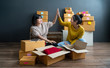 © sutthinon602 - Asian women entrepreneurs doing high five while working. Freelance woman seller check product order, packing goods for delivery to customer. Online selling, Online shopping and business success