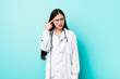 © Asier - Young chinese doctor woman showing a disappointment gesture with forefinger.
