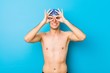 © Asier - Young swimmer man showing okay sign over eyes