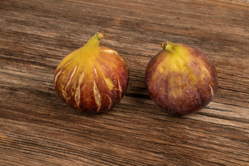 fresh and ripe figs on a wooden table