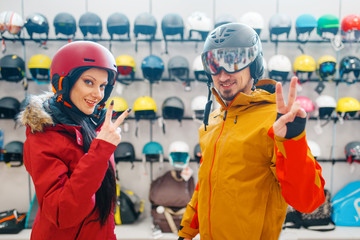 Wall Mural - Young couple in helmets for ski or snowboarding