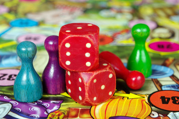 colorful play figures with dice on board