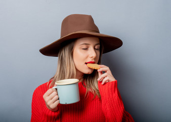 Sticker - woman in red sweater and cup with cookie