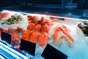 Wall Mural - fresh seafood prawns and crawfish and lobsters for sale at the market. Healthy mediterranean delicacy concept.