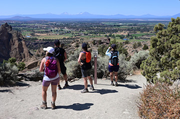 Wall Mural - Hikers on Misery Ridge Trail in Smith Rock State Park near Terrebonne, Oregon on a cloudless summer day.