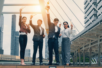 business background of asian business people being cheerful for being winner in business competition