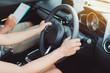© Kiattisak - Woman practice driving car exam driver licence control steering wheel education and learn on street road by driving instructor teaching at school drive transportation safety travel, people lifestyle