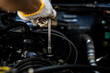 © DG PhotoStock - Man repair and maintenance engine of the old car.  Concept of safe driving and automobile care.