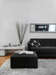 close up of a gray footrest and sofa in the modern living room
