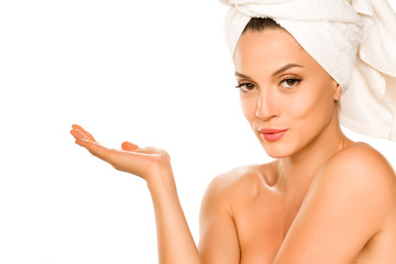 Poster - Young beautiful advertizing woman with towel on her head on white background