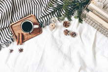 Christmas Styled Composition. Cup Of Coffee, Plaid, Old Books In Golden Basket, Pine Cones, Fir Branches On White Table, Linen Background. Flat Lay, Top View. Winter Holiday Lifestyle Concept, Web
