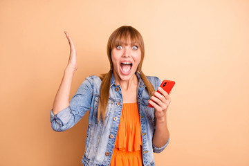 Canvas Print - Photo of yelling lady with telephone in hands reading great news wear casual outfit isolated beige background