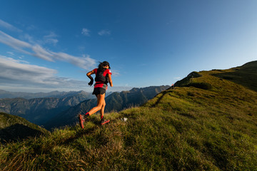sporty mountain woman rides in trail during endurance trail