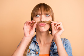 Poster - Close up photo of charming youth youngster hold hand haircut pigtail ponytail serious good-looking she her wear fashionable clothes isolated beige background