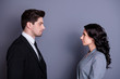 © deagreez - Profile side photo of minded people with wavy curly hairstyle brunet hairs standing face-to-face having disagreement wearing stylish blazer jacket tie isolated over grey background
