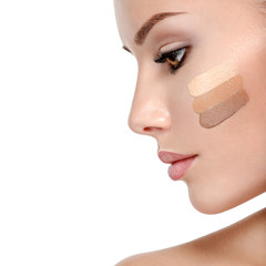 Wall Mural - beautiful face of woman with cosmetic foundation on a skin.