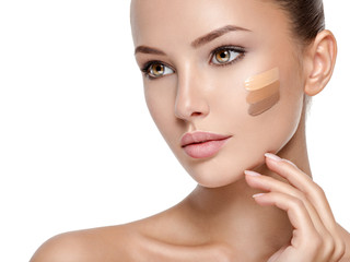 Wall Mural - beautiful face of woman with cosmetic foundation on a skin.