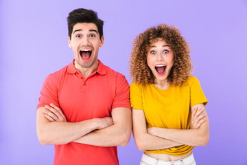 Poster - Portrait of excited caucasian people man and woman in basic clothing smiling together at camera with arms crossed