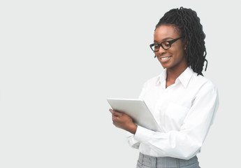 Sticker - African American Woman Reading Something On Tablet Computer In Studio