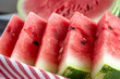 Close up of triangular slices of ripe fresh watermelon with red flesh