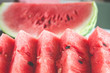 Close up of slices of ripe fresh watermelon with red flesh. Selective focus. Shallow depth of field