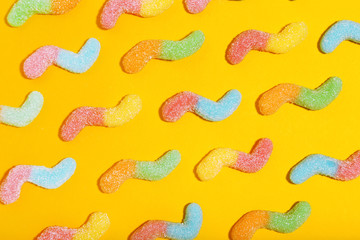 Sticker - Sweet gelatin candies on yellow background. Minimalism concept