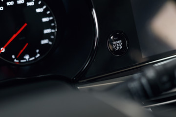 Wall Mural - Engine Start Stop button of a modern car. The interior of the expensive car