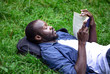 © proimagecontent - Black concentrated student guy preparing for exam outdoors