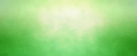 Green background with soft bokeh blur and bright yellow sun spot in elegant fresh and clean banner design